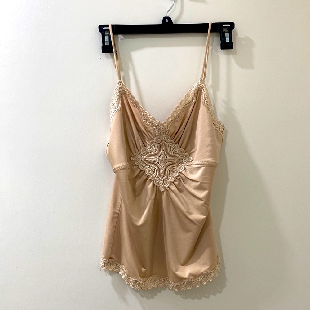 Beautiful and unique vintage like spaghetti strap piece. Silky comfort.